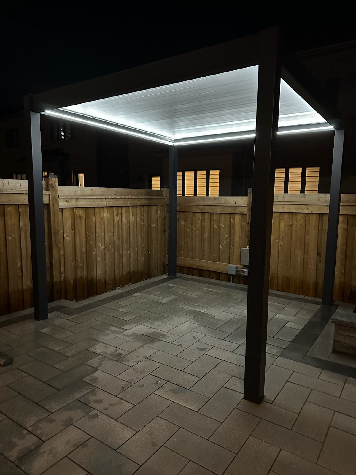 Modern LED pergola on stone patio