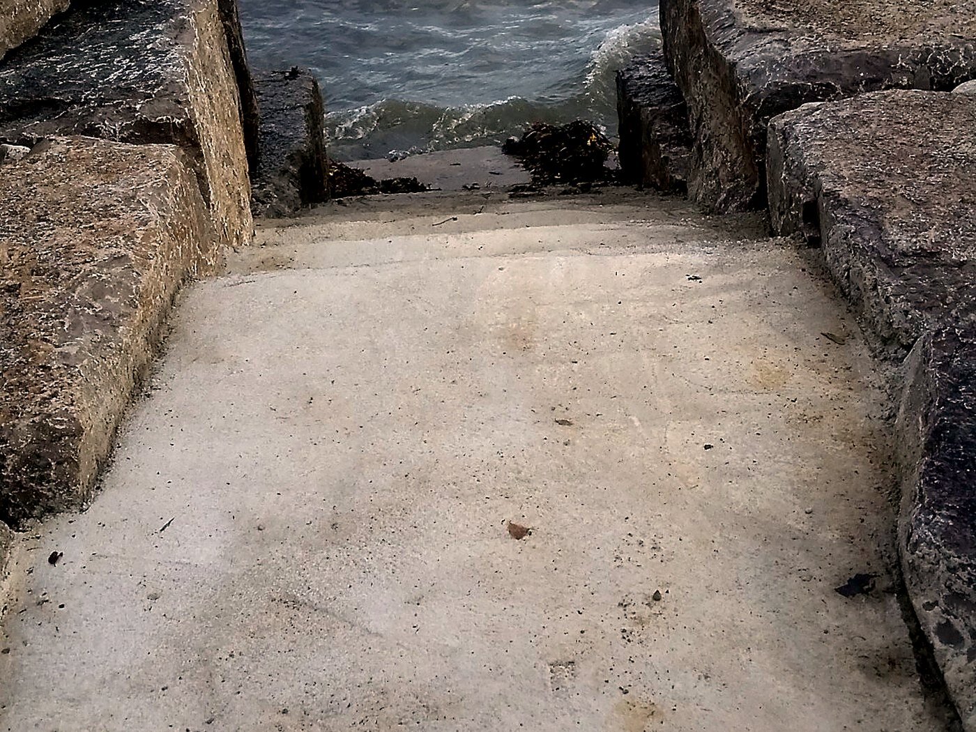 Waterfront stone entry with waves